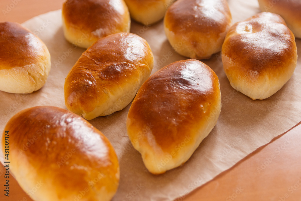 Baked pies or buns look very appetizing Baked pies or buns look very appetizing
