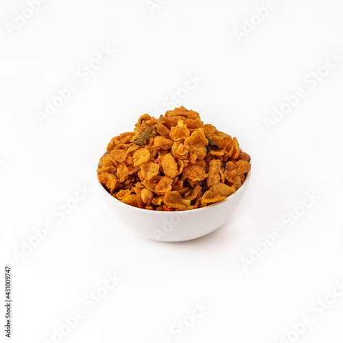 maka or cornflakes chivada or chiwada in white bowl on white background 