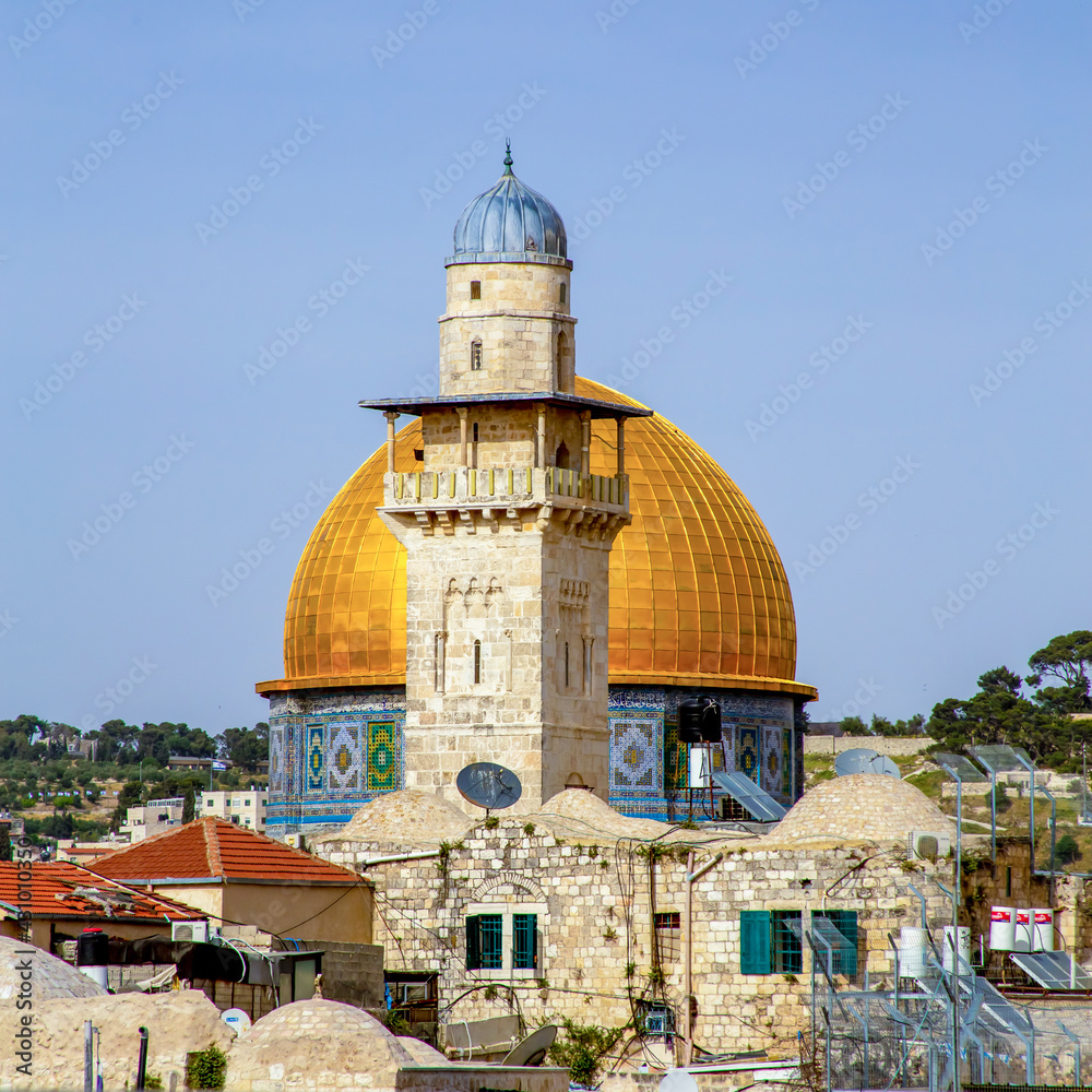 Jerusalem, Israel - 21 April 2021: Minaret and Dome of the Rock on a sunny day
