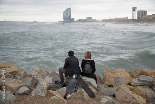 skate couple at the beach