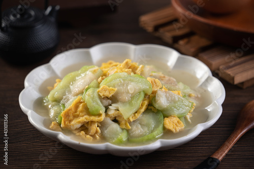 Taiwanese homemade local food of scrambled eggs with loofah gourd and sesame oil.