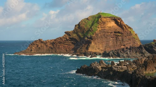 Ilheu Mole island with Farol do Porto Moniz monument Madeira, Portugal photo