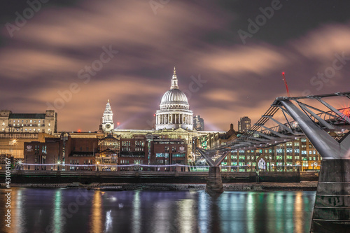 Fototapeta Naklejka Na Ścianę i Meble -  A mesmerizing shot of St. Paul's Cathedral and Millenium Bridge in London