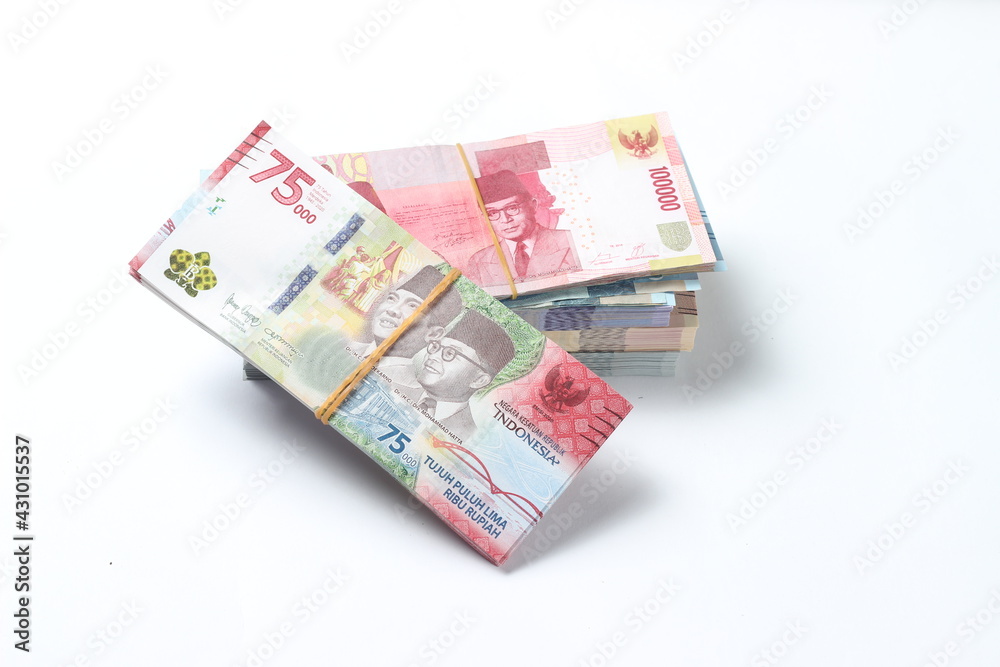Random Layout Photo Rupiah Paper Money, 10000, 50000, 100000 and 75000 at White Background