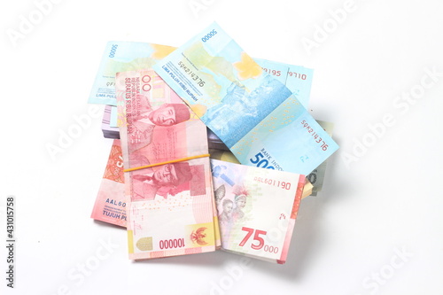 Random Layout Photo Rupiah Paper Money, 10000, 50000, 100000 and 75000 at White Background