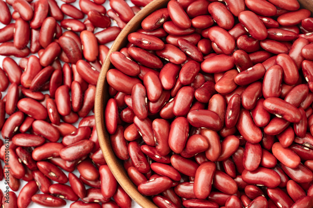 Top view of Kidney beans in wooden bowl on white background, copy space Top view of Kidney beans in wooden bowl on white background, copy space