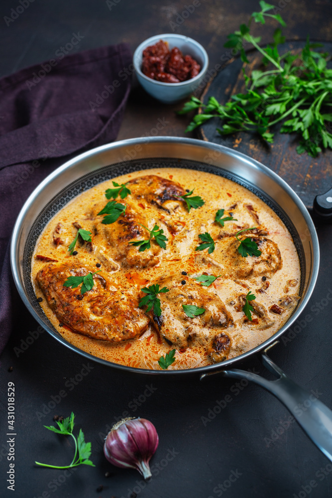 Cajun chicken in a creamy sauce prepared in a pan Cajun chicken in a creamy sauce prepared in a pan
