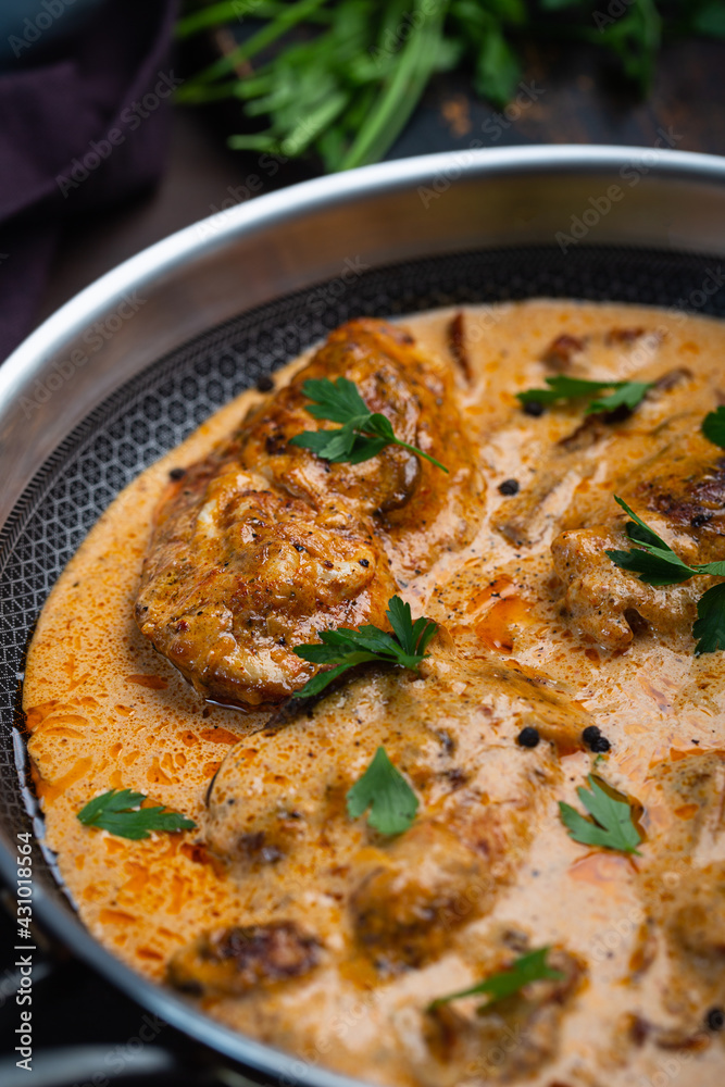 Cajun chicken in a creamy sauce prepared in a pan Cajun chicken in a creamy sauce prepared in a pan