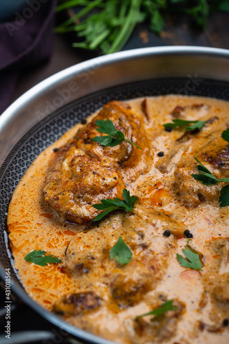 Cajun chicken in a creamy sauce prepared in a pan