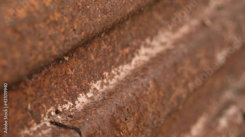 Closeup of rust on iron surface. Oxidized metal sheet. Vertical video