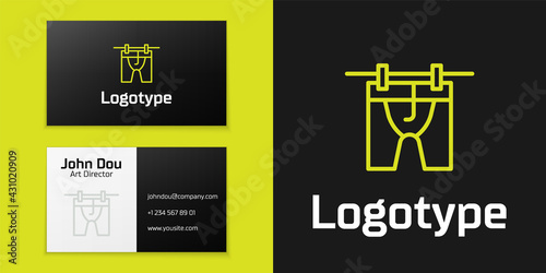 Logotype line Drying clothes icon isolated on black background. Clean shirt. Wash clothes on a rope with clothespins. Clothing care and tidiness. Logo design template element. Vector
