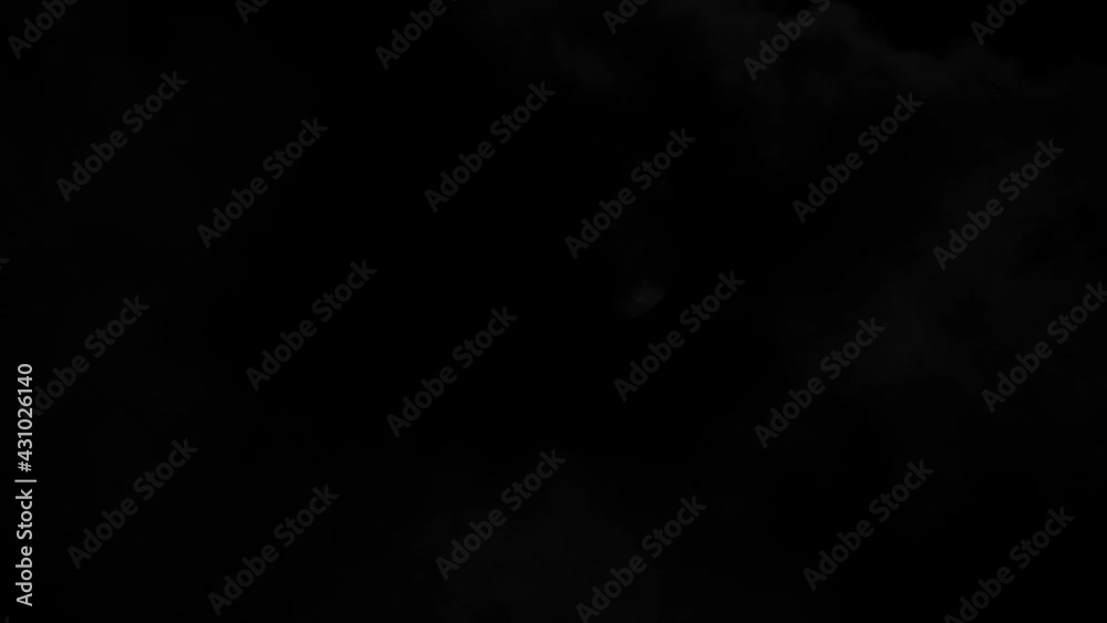 Moon on a dark night with clouds moving over it. Wobble image through a turbulent atmosphere Moon on a dark night with clouds moving over it. Wobble image through a turbulent atmosphere