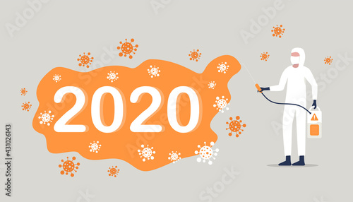 CAVID-19 coronavirus a worker in a protective suit sprays a disinfectant chemical to disinfect the viral pathogen.