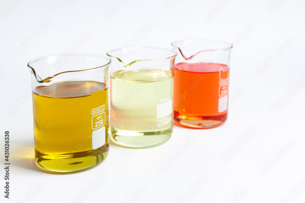 cosmetic natural oils in chemical glass jars cosmetic natural oils in chemical glass jars