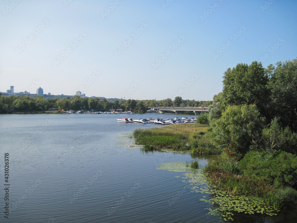 Scenic panoramic view of yachts and boats in the harbor. Cityscape with yachts in the bay on a sunny summer day. Scenic panoramic view of yachts and boats in the harbor. Cityscape with yachts in the bay on a sunny summer day.