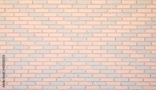 Gray-light pink brick wall baxkground. Brick wall pattern.