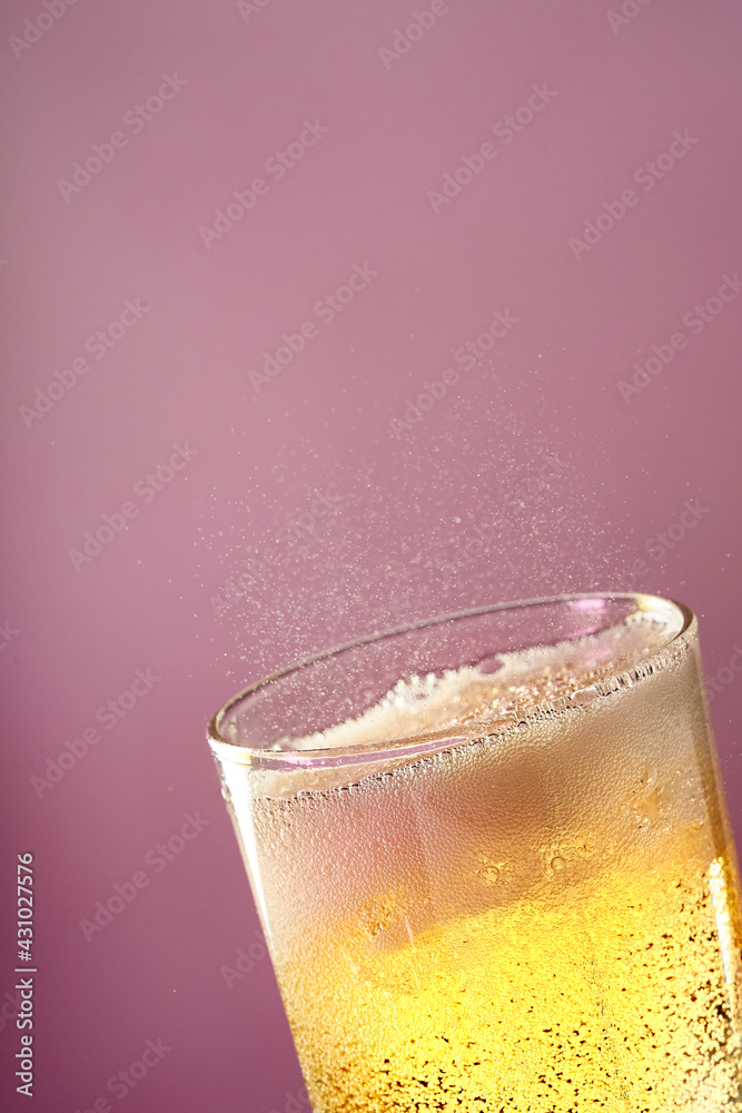 Fruit sparkling water is poured into a glass. Fruit sparkling water is poured into a glass.