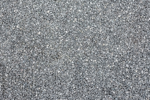 Natural fine crushed stone of gray color. Top view.