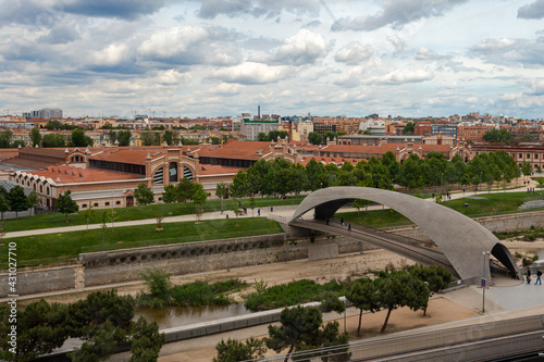 Panoramic of the city of Madrid and the Manzanares River. Matadero de Madrid next to the Manzanares river. Constructions next to the river. Urban photo