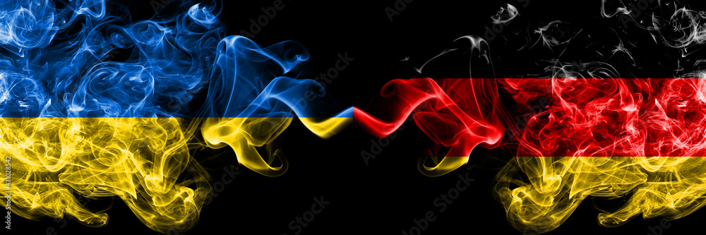 Ukraine, Ukrainian vs Germany, German, Deutschland smoky mystic flags placed side by side. Thick colored silky abstract smokes flags. Ukraine, Ukrainian vs Germany, German, Deutschland smoky mystic flags placed side by side. Thick colored silky abstract smokes flags.