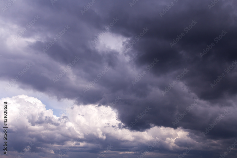 Epic Dramatic storm sky with dark grey black and white cumulus rainy clouds background texture, thunderstorm