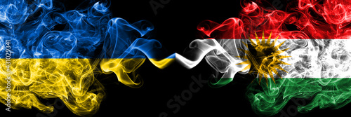 Ukraine, Ukrainian vs Kurdistan, Kurdish, Kurds smoky mystic flags placed side by side. Thick colored silky abstract smokes flags. photo