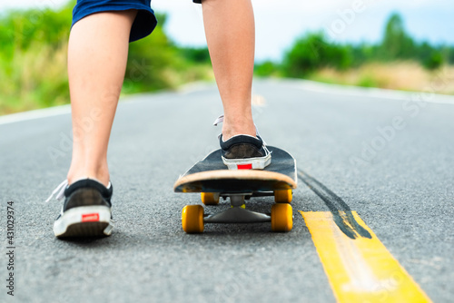 Child Start to Skate on the Asphalt Road