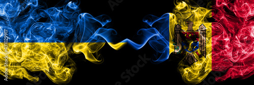 Ukraine  Ukrainian vs Moldova  Moldovan smoky mystic flags placed side by side. Thick colored silky abstract smokes flags.