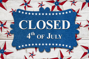 Closed 4th of July sign with USA flag stars