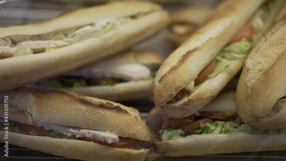 Sandwiches on display at store through glass window. Sandwich Sandwiches on display at store through glass window. Sandwich