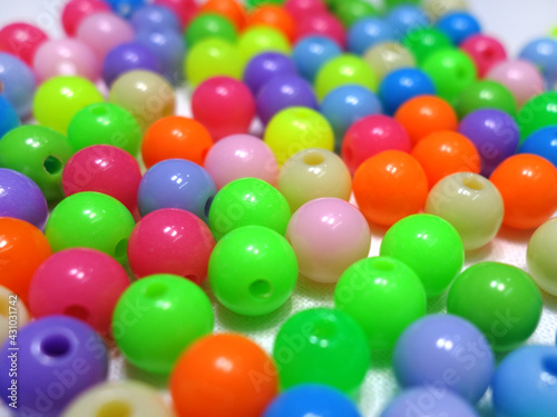 Photo background of scattered round acrylic colored beads
