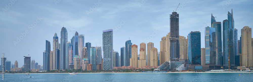 Obraz premium high-rise buildings stand on the horizon, modern Dubai
