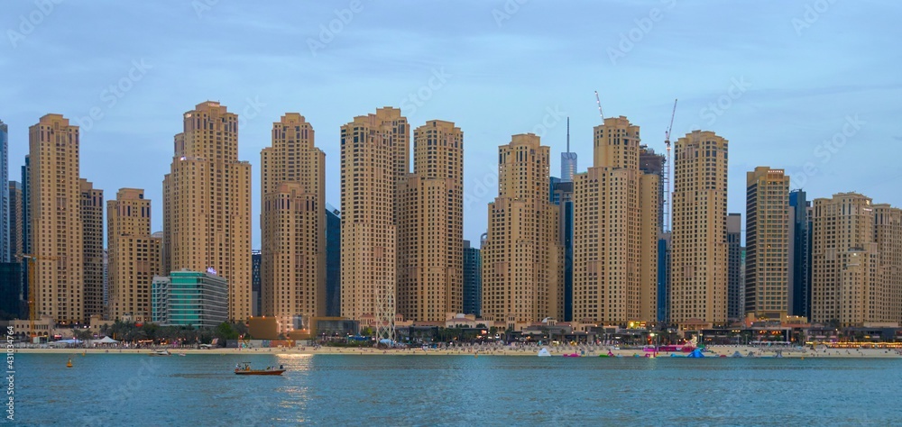 high-rise buildings stand on the horizon, modern Dubai