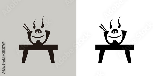 Noodle bowl with monkey character on the table.