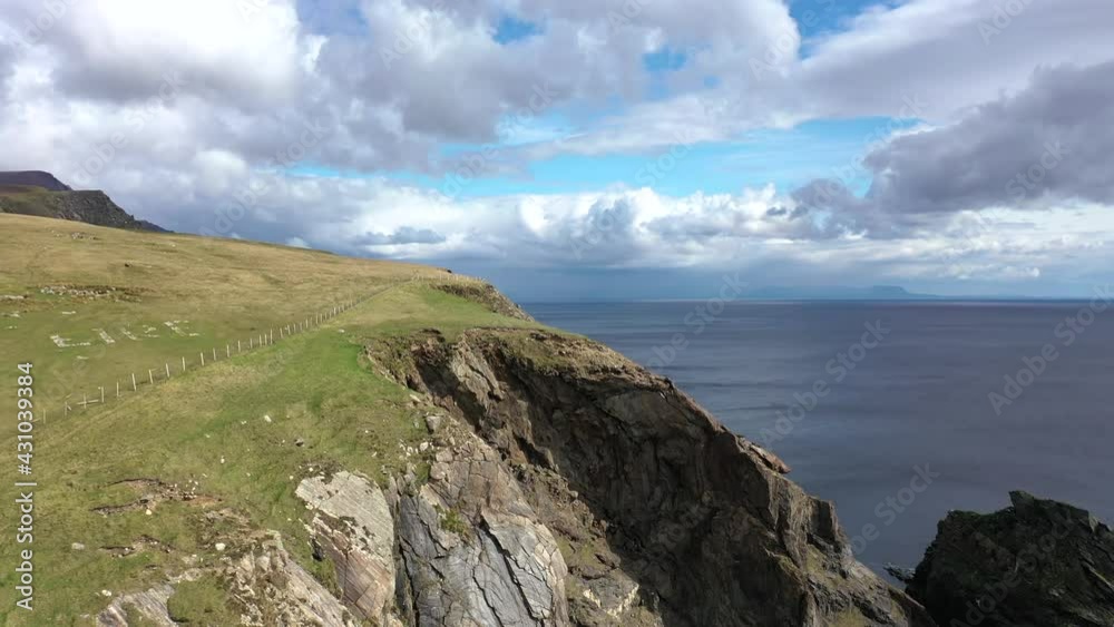 Aerial view of the beautiful coast at Malin Beg with Slieve League in the background in County Donegal - Ireland Aerial view of the beautiful coast at Malin Beg with Slieve League in the background in County Donegal - Ireland