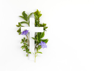 The Christianity cross of green leaves. Baptism, Easter, church holiday background