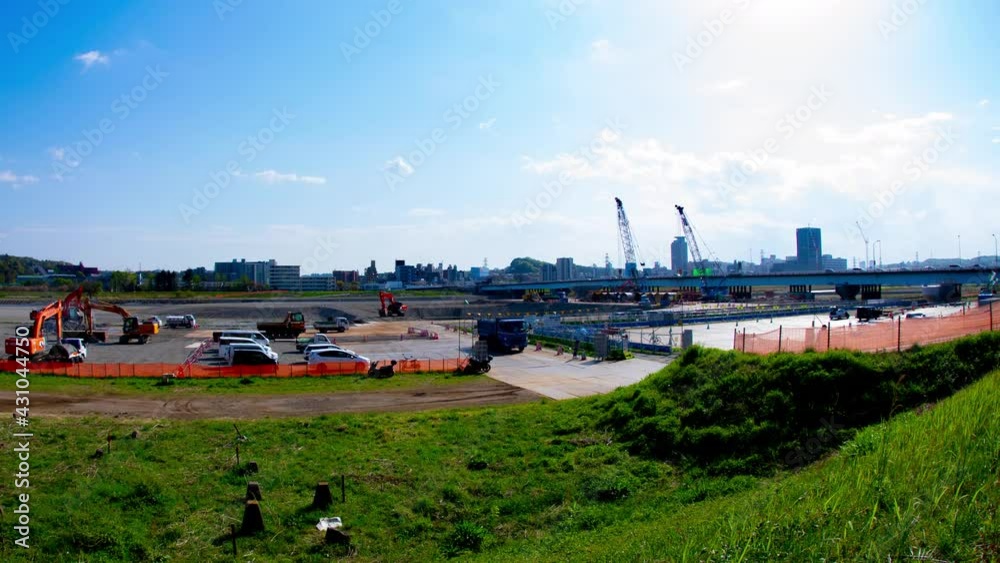 A timelapse of moving cranes at the under construction daytime wide shot zoom A timelapse of moving cranes at the under construction daytime wide shot zoom