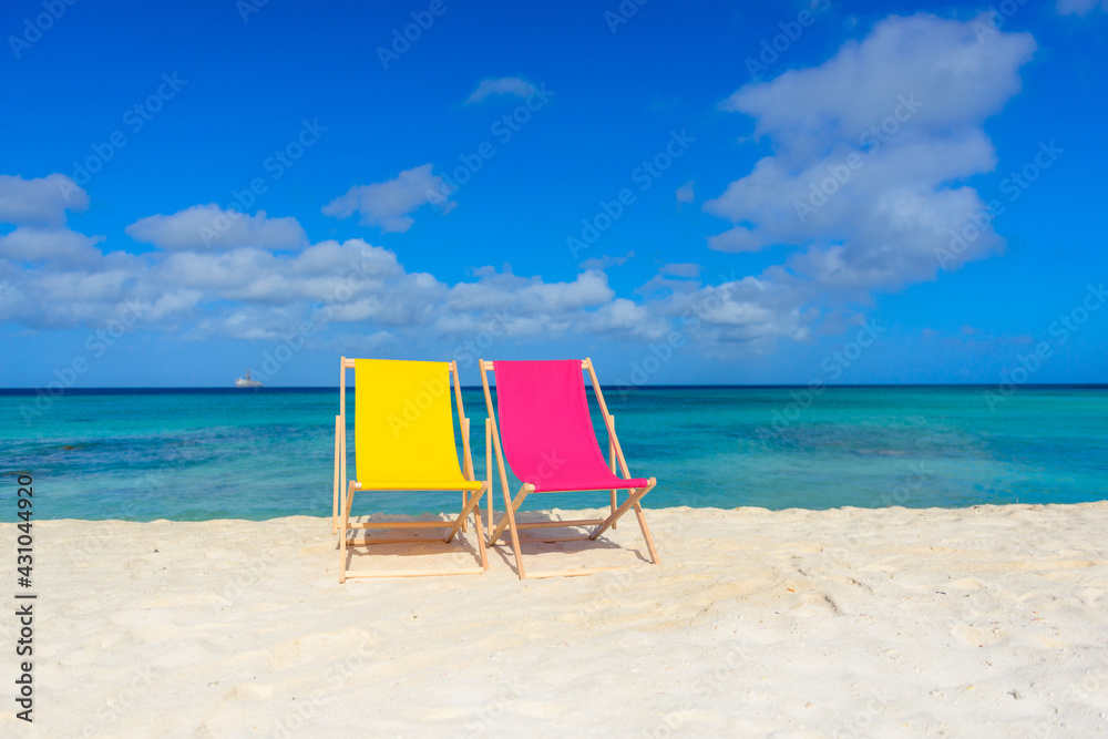 Colorful beach lounge chairs at the beach