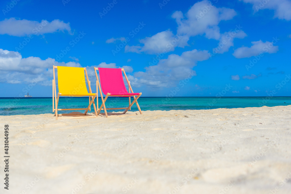 Colorful beach lounge chairs at the beach Colorful beach lounge chairs at the beach