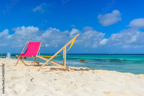 Fototapeta Naklejka Na Ścianę i Meble -  Colorful lounge chairs at the beach