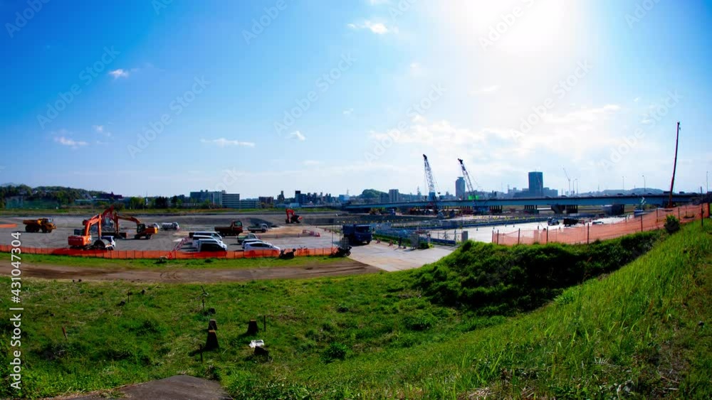 A timelapse of moving cranes at the under construction daytime wide shot tilt A timelapse of moving cranes at the under construction daytime wide shot tilt