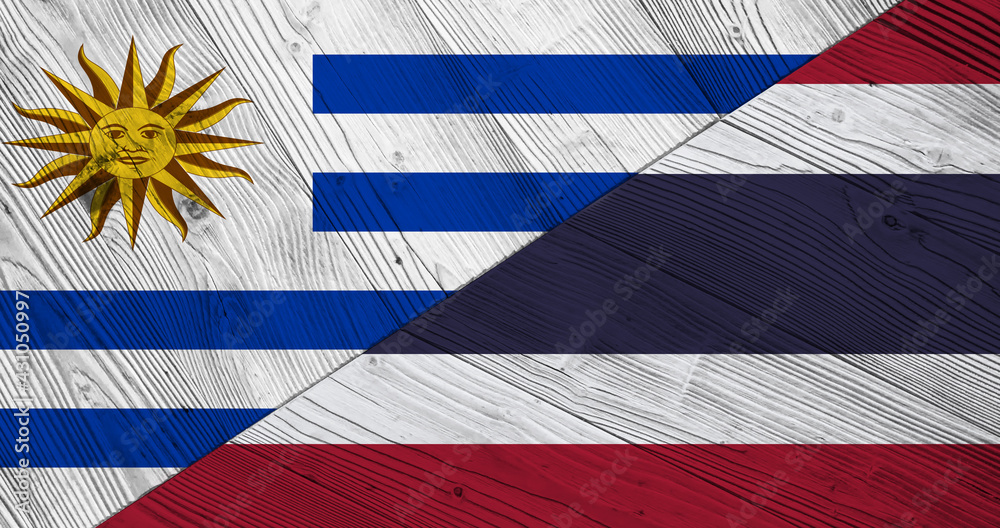 Fototapeta premium Flag of Uruguay and Thailand on wooden planks