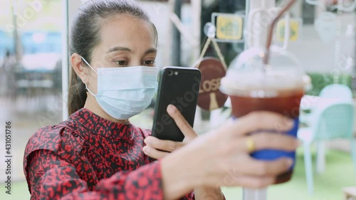 Asian woman wearing  coffee mug