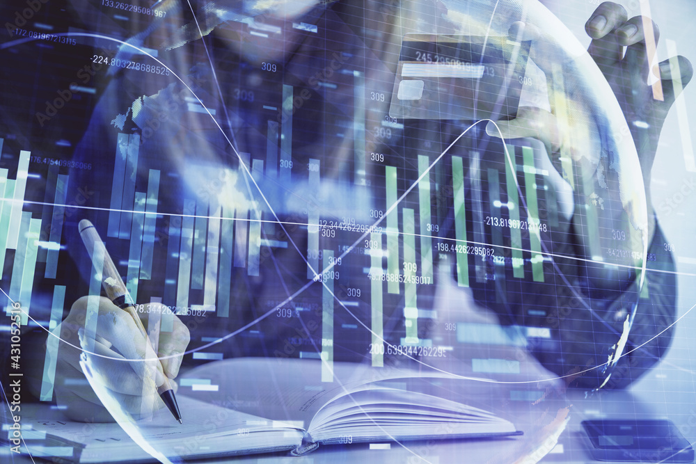 Multi exposure of woman on-line shopping holding a credit card and financial theme drawing. Business E-commerce concept. Multi exposure of woman on-line shopping holding a credit card and financial theme drawing. Business E-commerce concept.