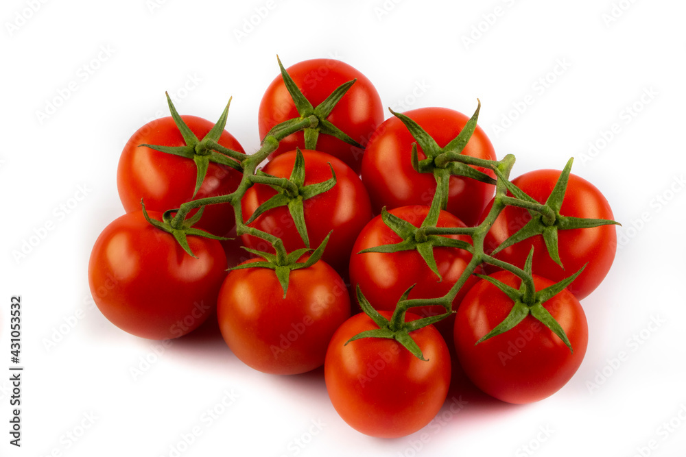 Fresh cherry tomatoes with a sprig isolated on a white background. Tomato branch. Fresh tomatoes with green leaves.