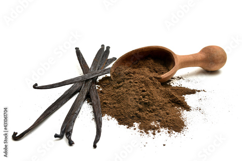 Dried Vanilla sticks and powder with spoon isolated on white background