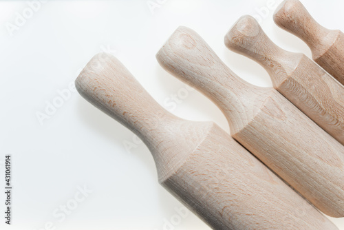 plain beech wood scoops on a white background with slight shadow