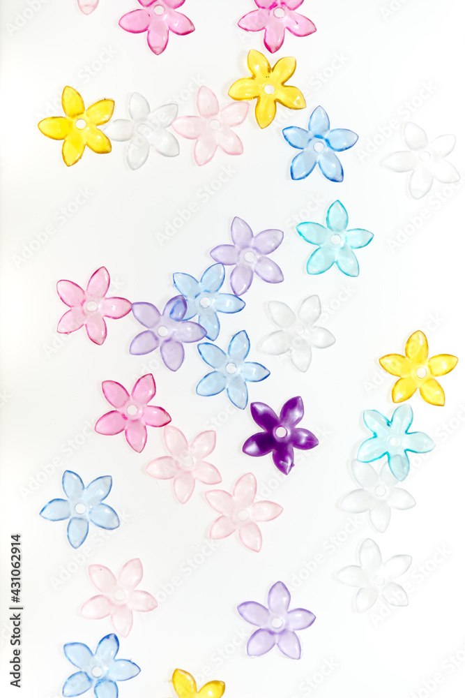 plastic (jewelry) five-petal flower beads on a white background