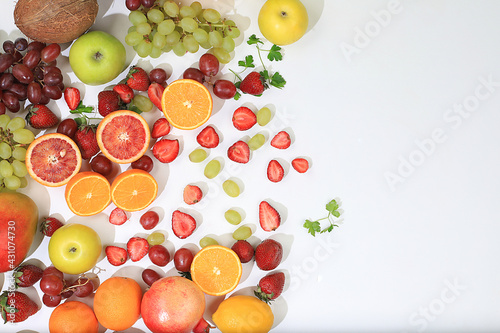 Fresh fruits and berries on a bright sunny table  the concept of natural and healthy food  a source of vitamins and antioxidants  ingredients for a healthy breakfast  detox diet and weight loss  