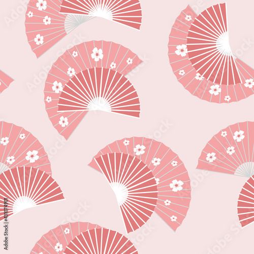 Delicate seamless fan pattern with cherry blossoms. White flowers on a pink background. Asian Japanese national accessories  style. Vector graphics.